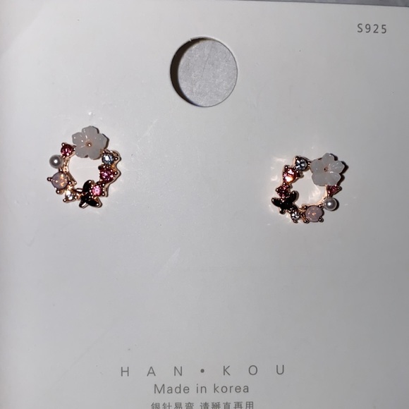 Fashion Jewelry Jewelry - Floral wreath earrings. One butterfly a flower and studded pink crystals.